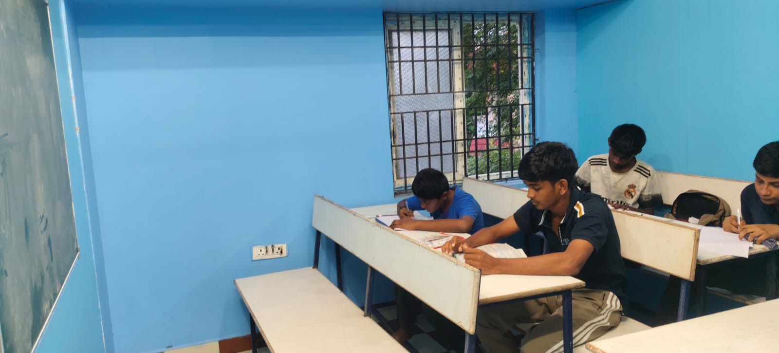 Boys studying at JP Goodwill
